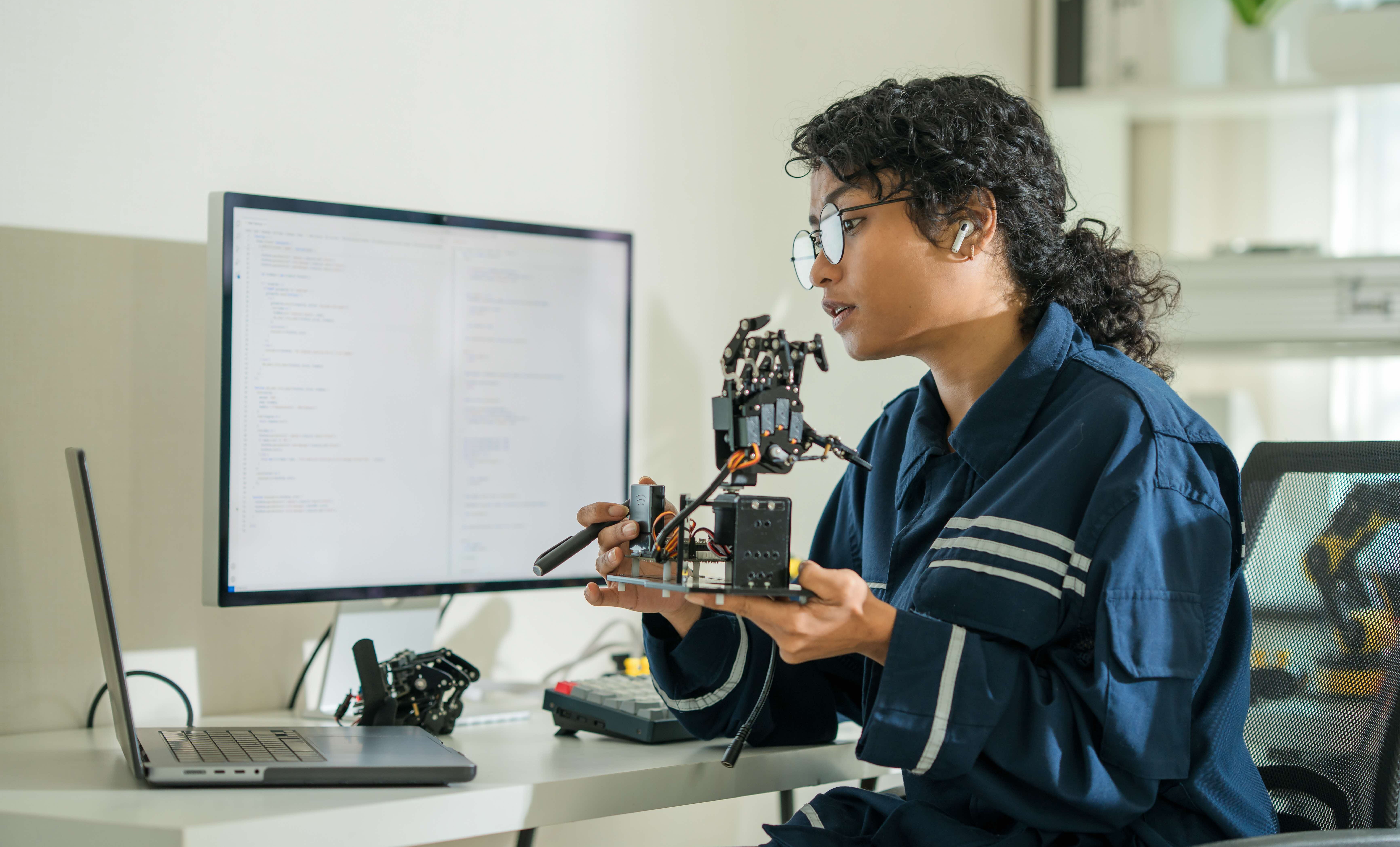 intro-img-4-Woman in stem with a robotics model