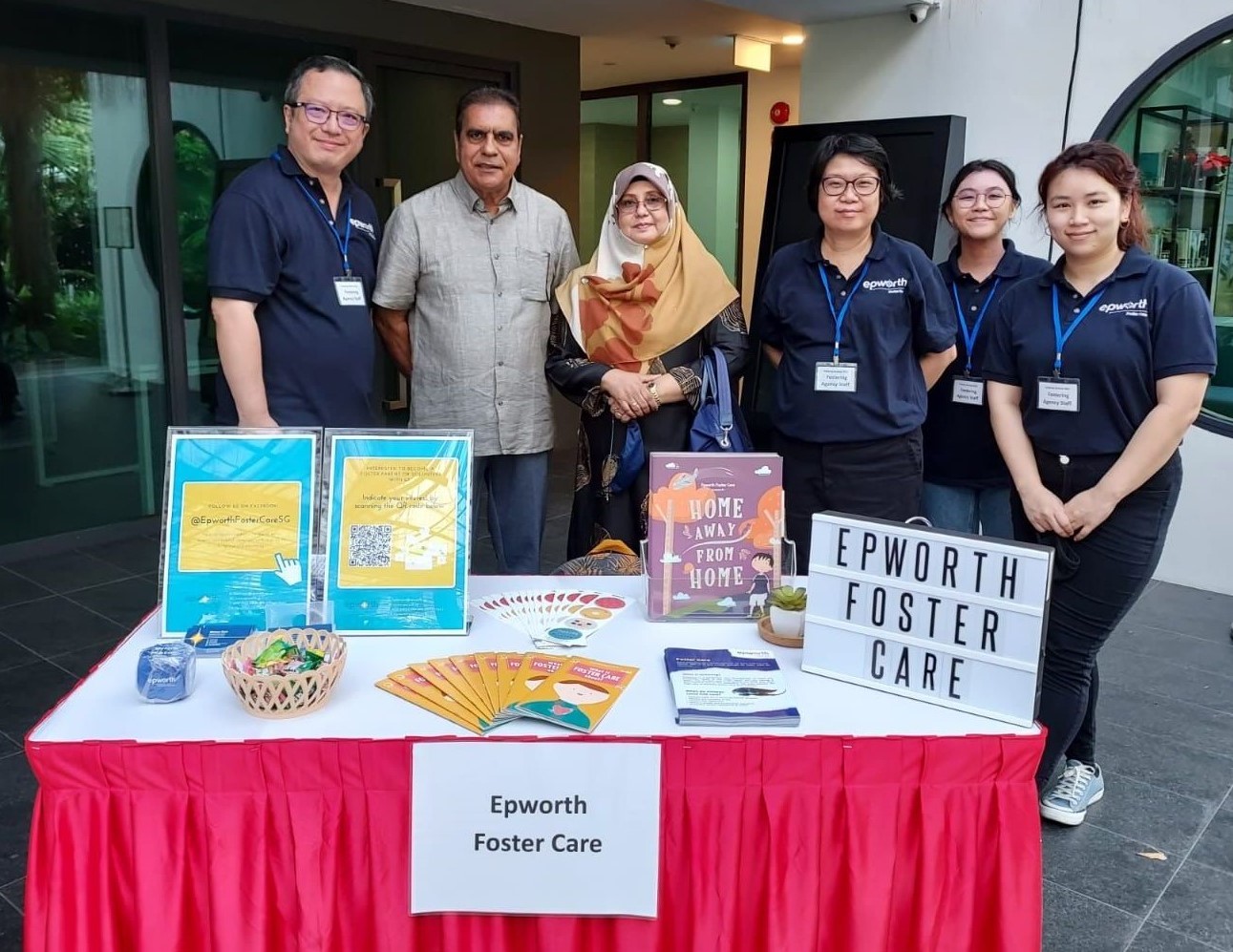 Foster parents and staff at our booth (set up at a recruitment event)